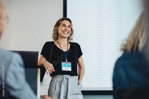 Fotobehang Business woman delivering a speech in a conference