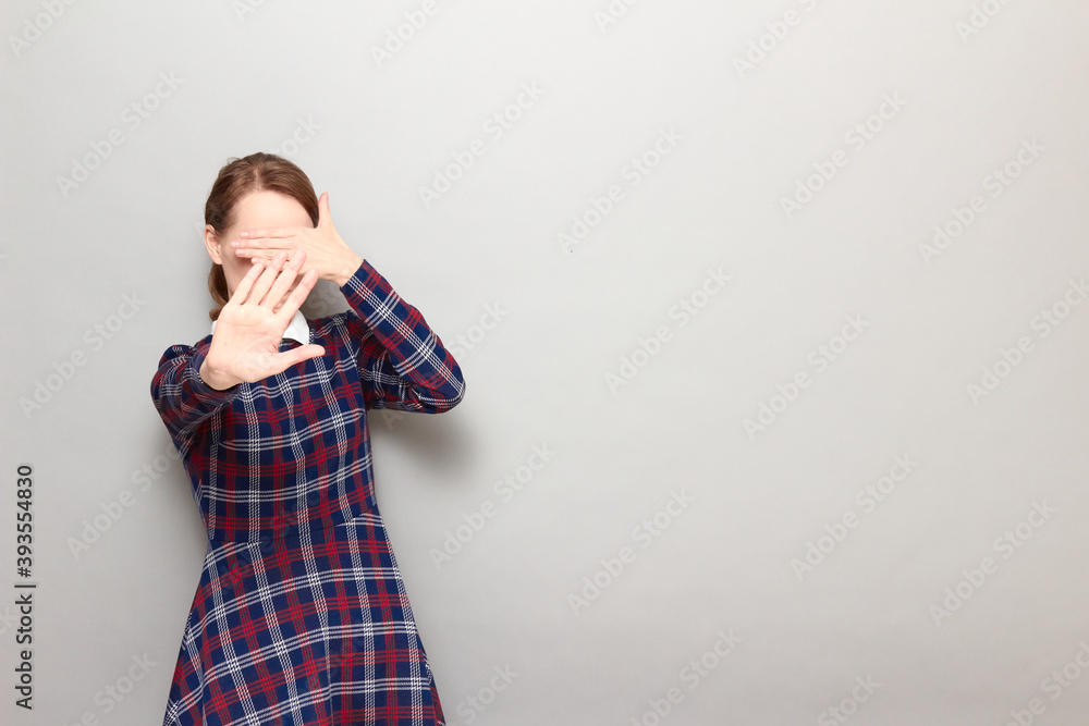 Girl is stretching palm to camera, covering her face and eyes Girl is stretching palm to camera, covering her face and eyes