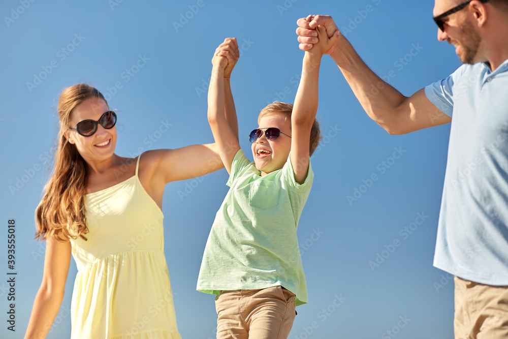 family, leisure and people concept - happy mother, father and little son having fun in summer family, leisure and people concept - happy mother, father and little son having fun in summer