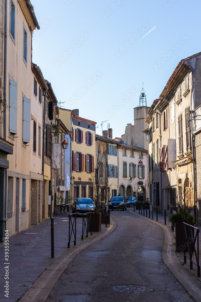 Carcassonne / France - March 11, 2020 - The Cité de Carcassonne is a medieval citadel in the department of Aude, Occitanie region. Picturesque typical narrow street Rue de la Trivalle.