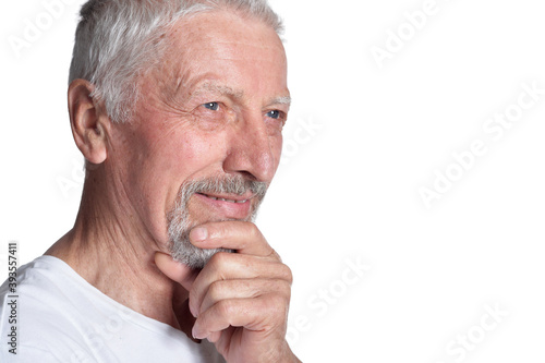 Close up portrait of senior man posing on white background
