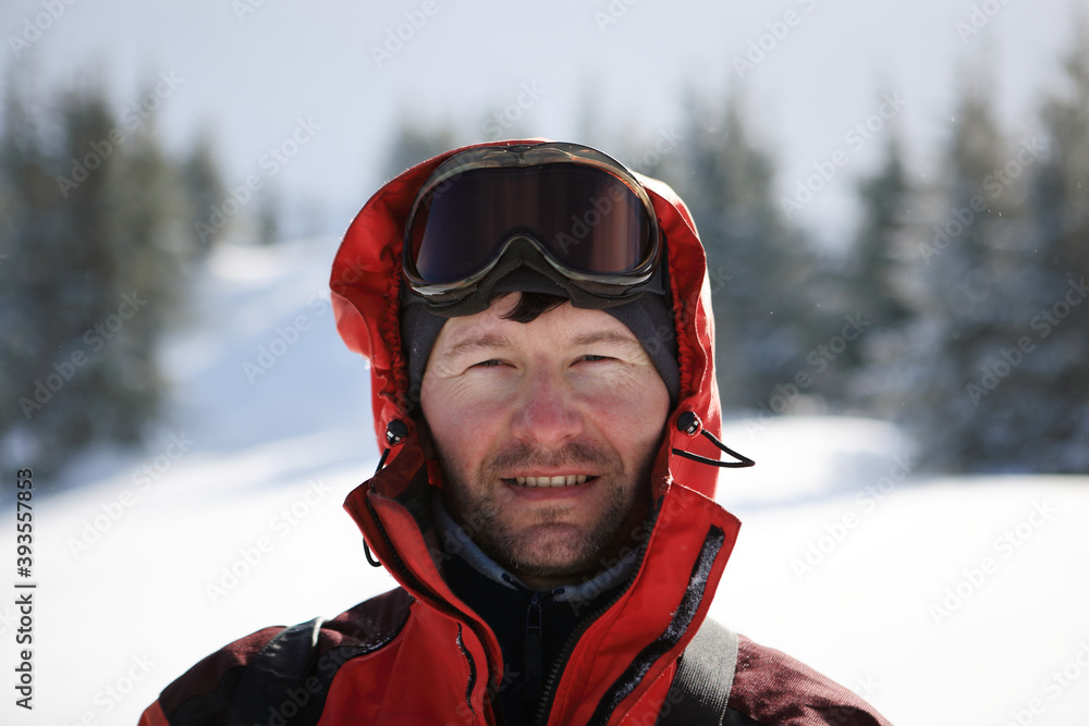 Hiker on the slopes of the mountains in winter. Hiker on the slopes of the mountains in winter.