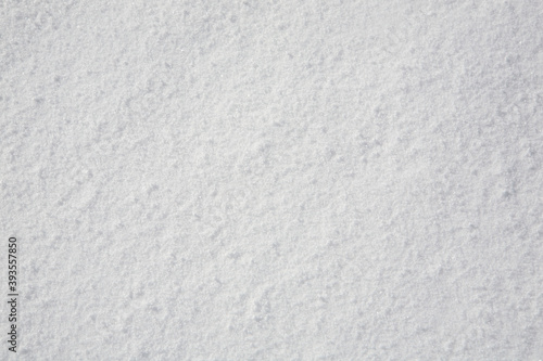 Snow texture. Shot on the slopes of the mountains.