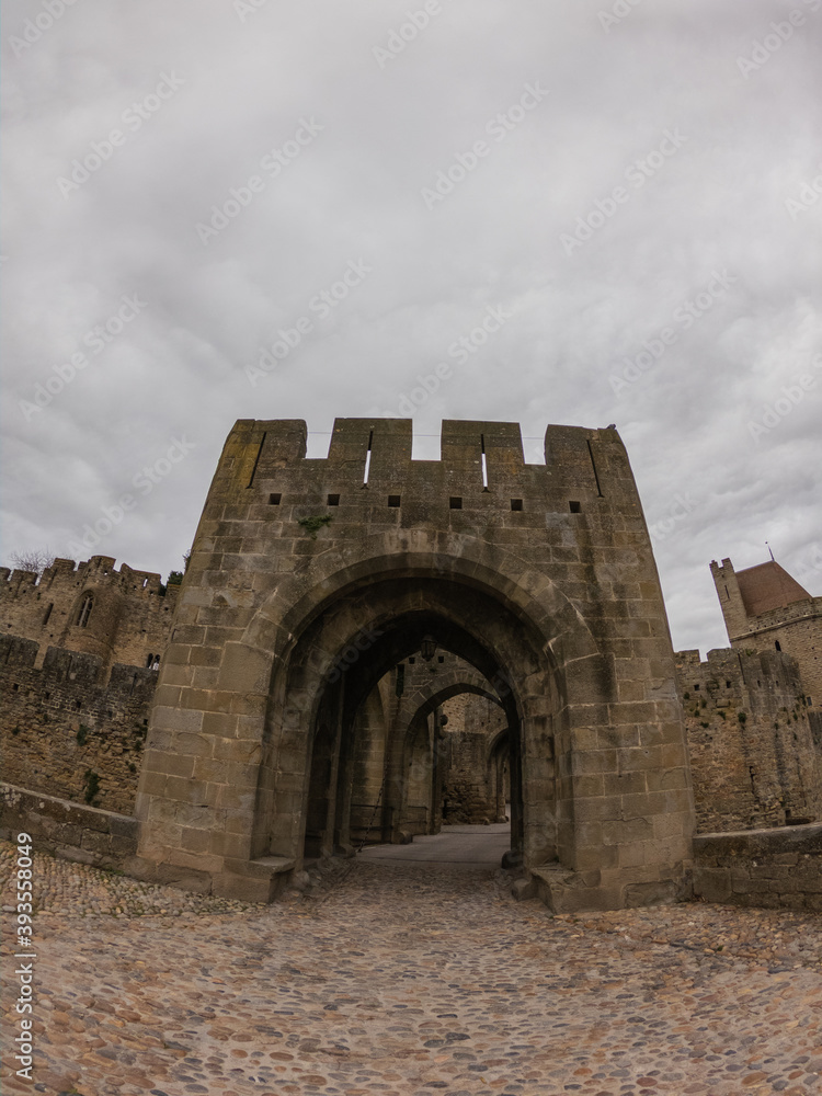 Fortifications of the medieval city of Carcassonne, France. The Narbonnaise gate, was built around 1280 during the reign of Philip III the Bold and was made up of two enormous spur towers.