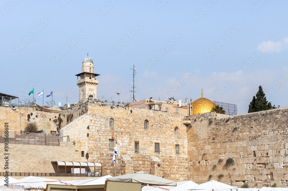 The Western Wall, the Bab al-Silsila minaret and the Dome of the Rock are in the old city of Jerusalem in Israel
