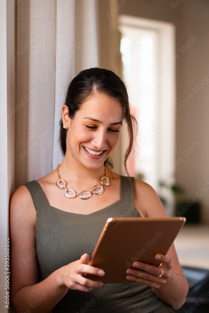 Confident business woman checking report on digital tablet in coworking open space. Strategy, information, professional, corporate concept.. Confident business woman checking report on digital tablet in coworking open space. Strategy, information, professional, corporate concept..