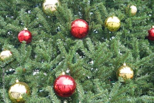 christmas tree with multi-colored balls and decorations background