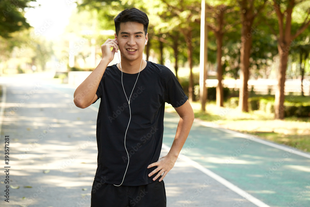 A young man walks outdoor as workout A young man walks outdoor as workout