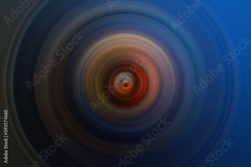 Abstract round orange background. Circles from the center point. Image of diverging circles. Rotation that creates circles.