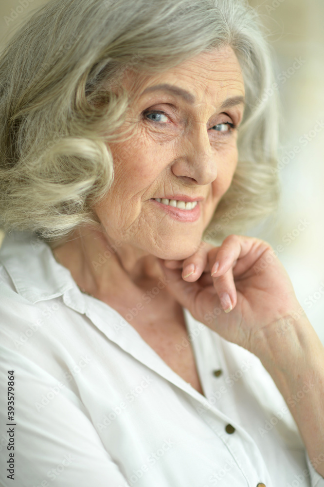 Close-up portrait of a smiling senior woman Close-up portrait of a smiling senior woman