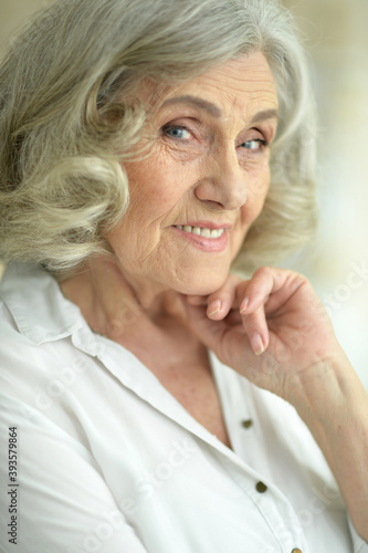 Close-up portrait of a smiling senior woman