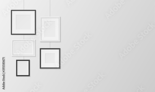 Pictures, photos frames white and black design hanging on wall horizontal banner. Passepartout.