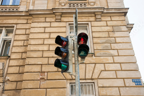 Red traffic light against building; Prague; Czech Republic