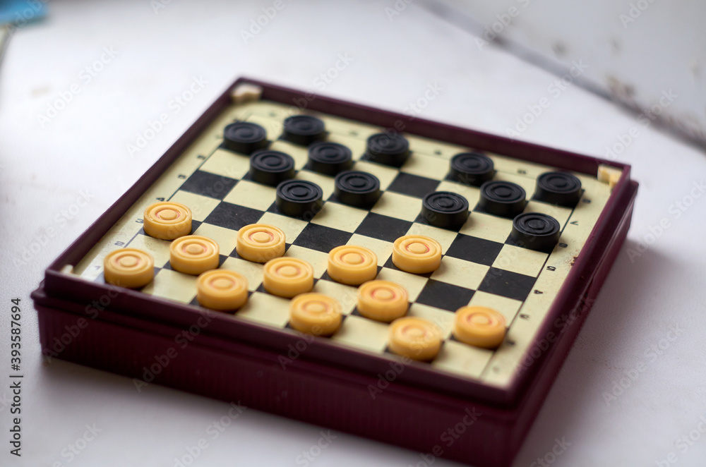 Photo of checkers on the board Photo of checkers on the board