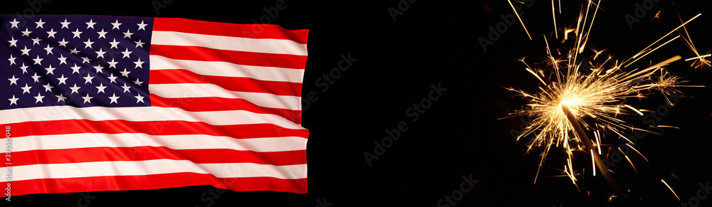 American Celebration - United States, Usa flag flowing in the wind and burning sparkler firework on black web banner background. American flag for Memorial Day, July 4th, Labor Day concept. copy space American Celebration - United States, Usa flag flowing in the wind and burning sparkler firework on black web banner background. American flag for Memorial Day, July 4th, Labor Day concept. copy space