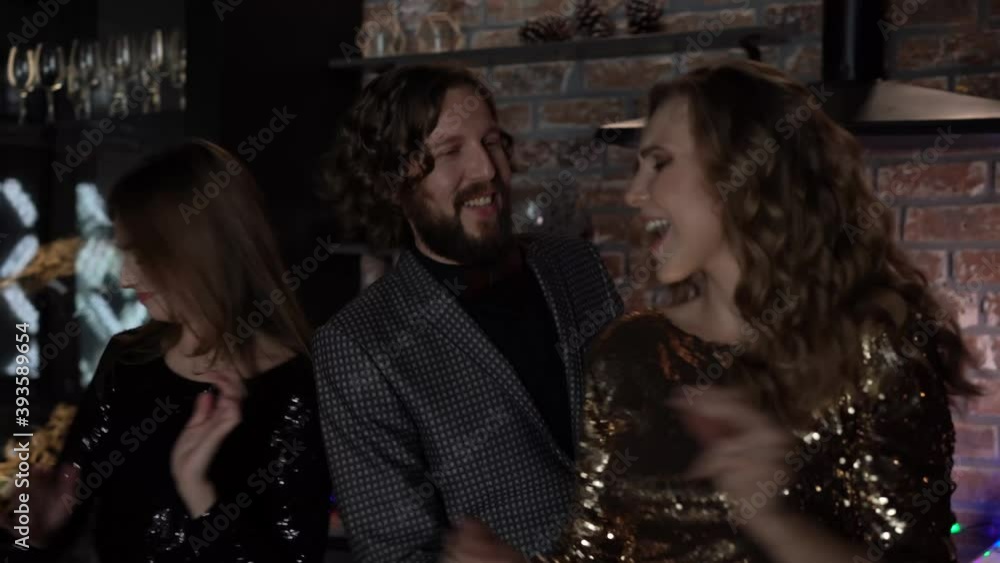 friends celebrating new years eve party dancing throwing confetti enjoying friends celebrating new years eve party dancing throwing confetti enjoying