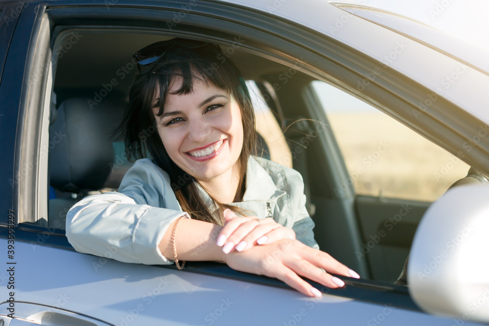 Woman driver with beautiful smile white teeth.