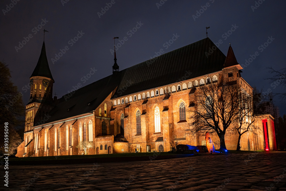 Brick Gothic style Cathedral at night, side view. Formerly old German Konigsberg Cathedral, Kaliningrad, Russia