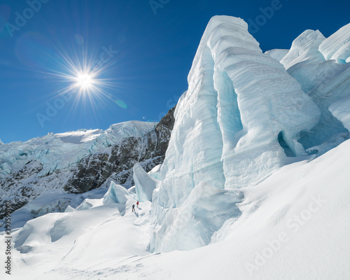 Two men Trekking on The Tasman Glacier (Haupapa) which is the largest glacier in the Southern Alps, South Island, New Zealand.  photo