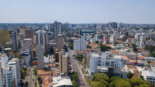 Drone image taken which shows a panoramic view of the Alto da XV neighborhood in Curitiba, capital of the state of Paraná, Brazil, with its buildings and trees © Roberto