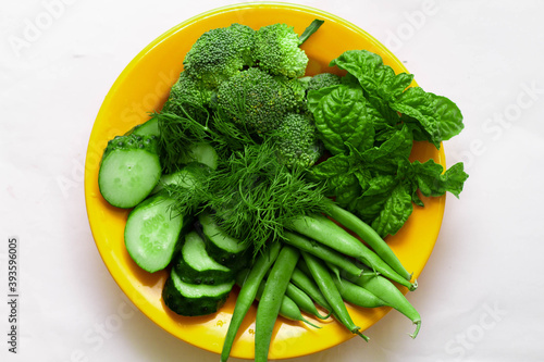 fresh green vegetables on a plate