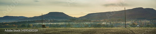 panorama of the autumn mountains in the morning with fog