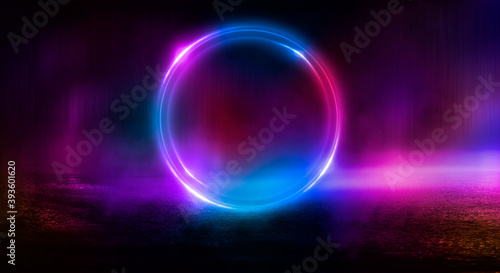 Dark abstract background. Neon light circle figure. Reflection of neon light on the water.  © MiaStendal