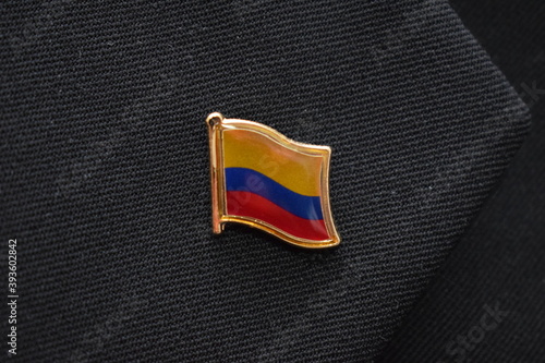 Columbia Flag lapel pin on a suit