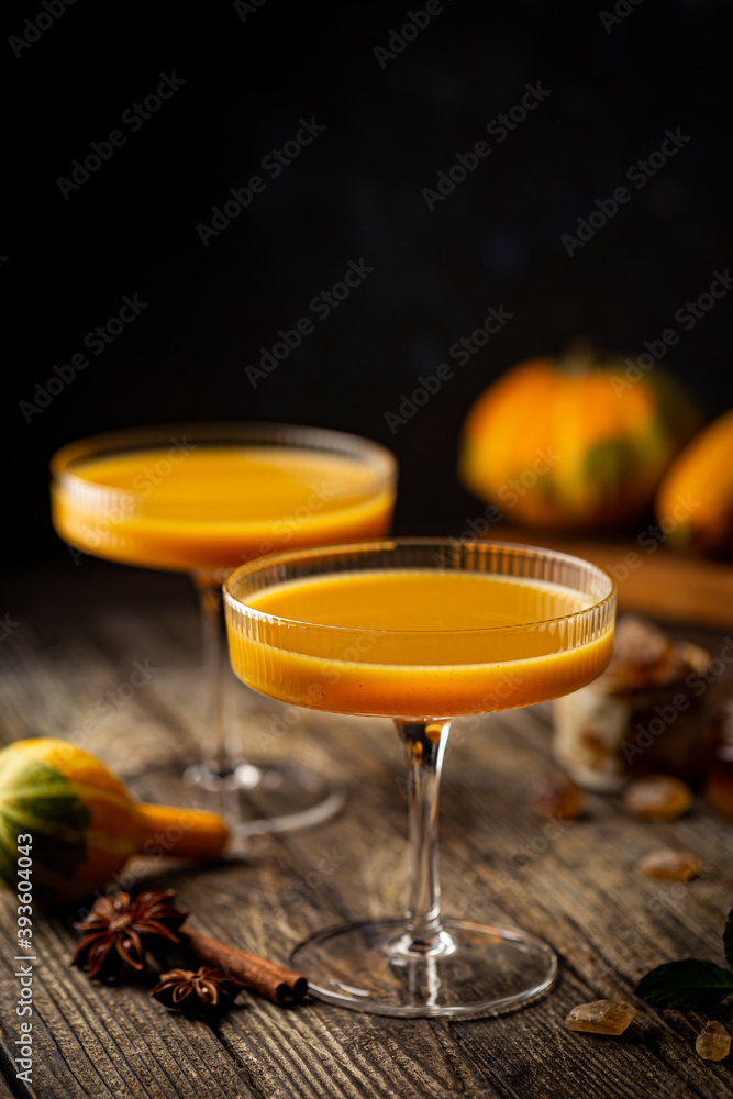Pumpkin and orange spiced fall cocktail with cinnamon Pumpkin and orange spiced fall cocktail with cinnamon