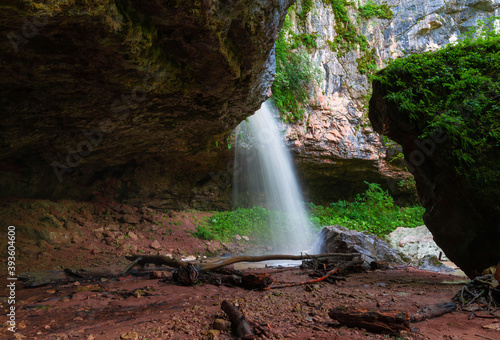 Mountain day summer. Waterfall Caucasus, mainsail cave
