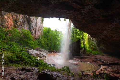 Mountain day summer. Waterfall Caucasus  mainsail cave