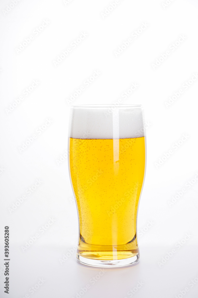 Glass of light beer on a white background Glass of light beer on a white background