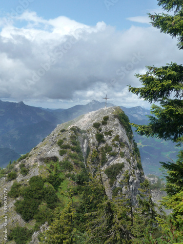 Summit cross Naunspitze mountain hiking tour in Tyrol, Austria photo