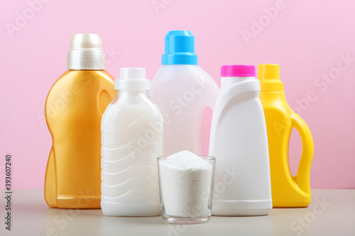 Bottles of laundry detergent on the table. Household chemicals photo