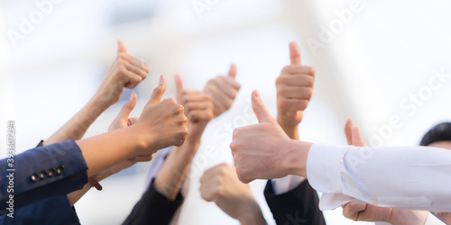 Different business people group raising hands