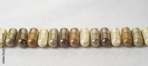 Various medical capsules on a white surface