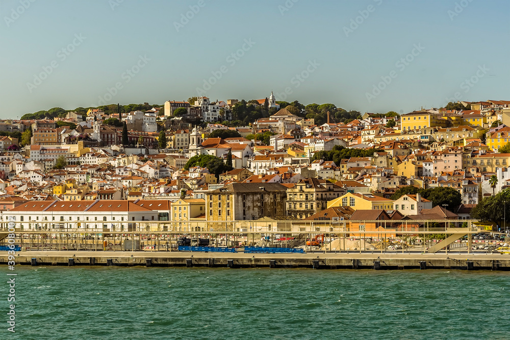 A view of the castle hill in the old quarter of Lisbon, Portugal from the Tagus river