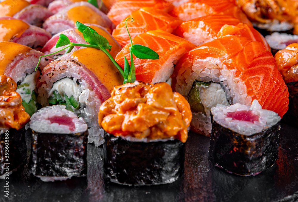 set of sushi roll with salmon, avocado, cream cheese, cucumber, rice, tuna set of sushi roll with salmon, avocado, cream cheese, cucumber, rice, tuna