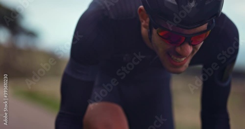 Professional cyclist struggling to ride bicycle during training