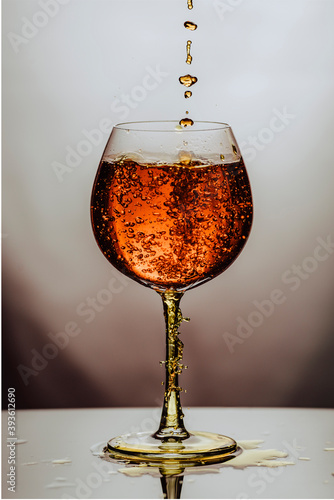 Alcoho in translucent glass on white background.