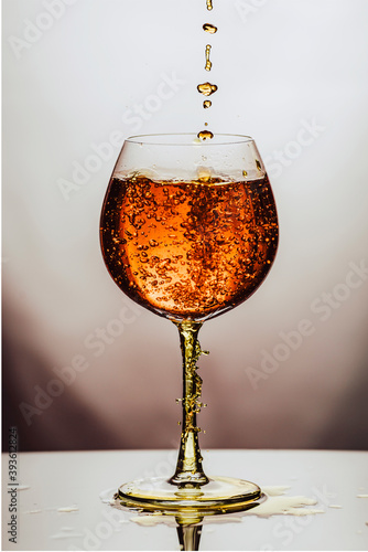 Alcoho in translucent glass on white background.