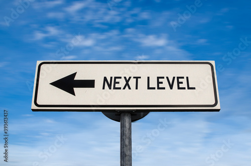 Next level road sign, arrow on blue sky background. One way blank road sign with copy space. Arrow on a pole pointing in one direction.