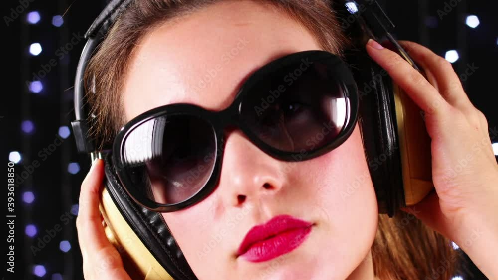 Girl wearing sunglasses and headphones Girl wearing sunglasses and headphones