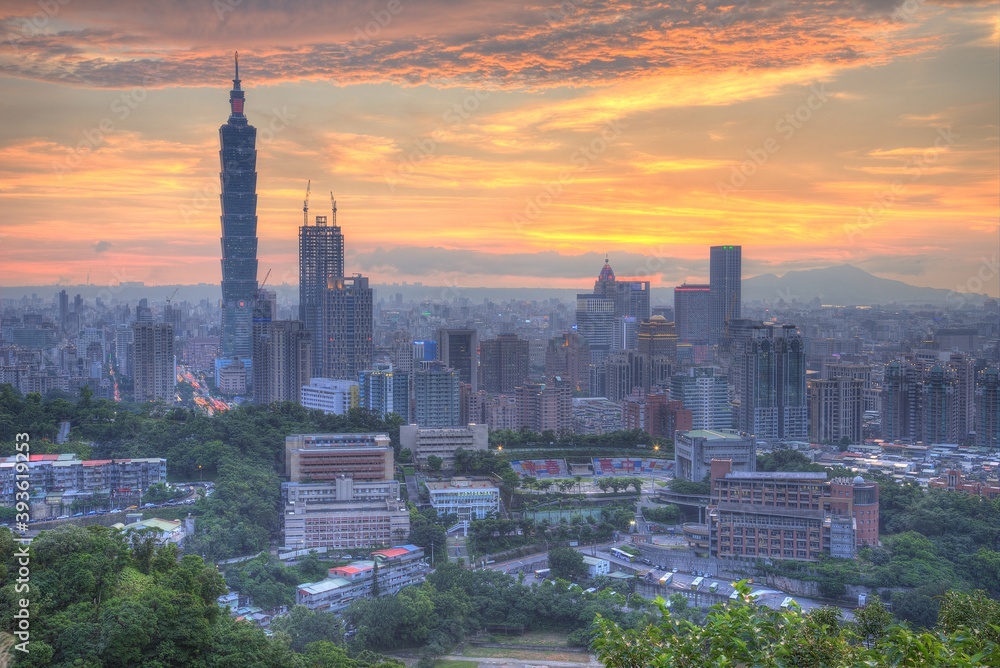 Aerial panorama of downtown Taipei City with Taipei 101 Tower among skyscrapers under dramatic sky ~ A romantic evening in Taipei, the capital city of Taiwan, with beautiful rosy afterglow at sunset