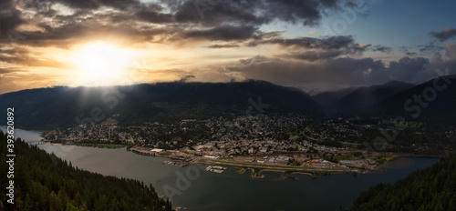Beautiful Panoramic View of a small Town, Nelson. Dramatic Sunrise Sky Art Render. Located in the Interior of British Columbia, Canada.