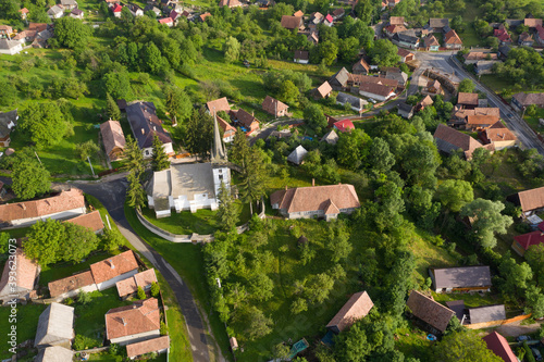 Aerial drone point of view of a whitewashed protestant church photo