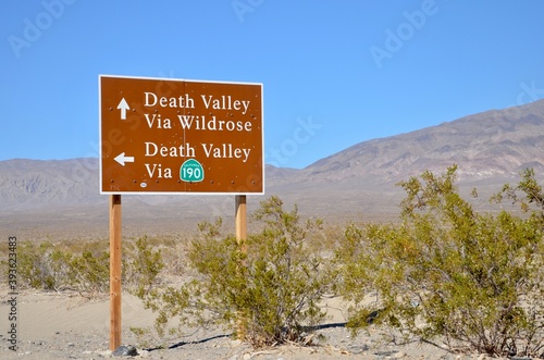 Street sign about Death Valley in California, USA, blue sky background, desert landscape