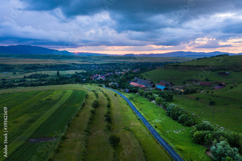 Aerial view of a storm and clouds above a village