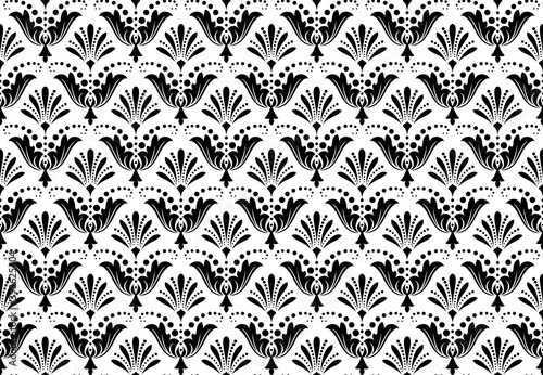 Wallpaper in the style of Baroque. Seamless vector background. White and black floral ornament. Graphic pattern for fabric, wallpaper, packaging. Ornate Damask flower ornament