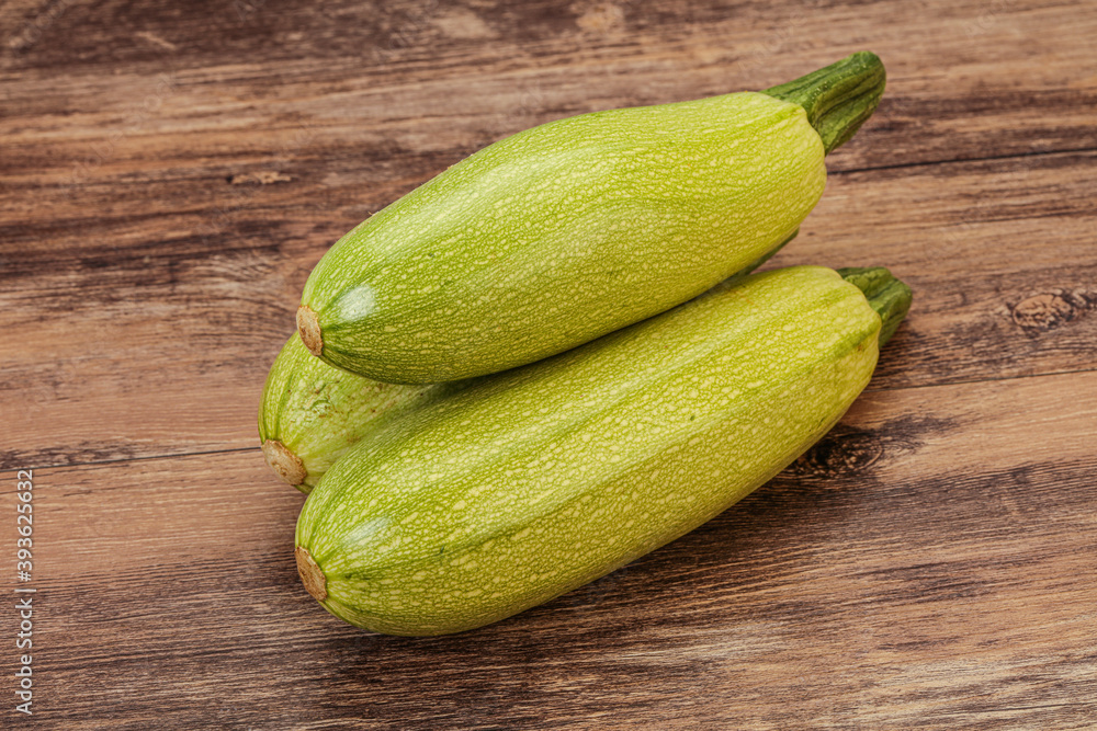 Young tasty zucchini over board Young tasty zucchini over board